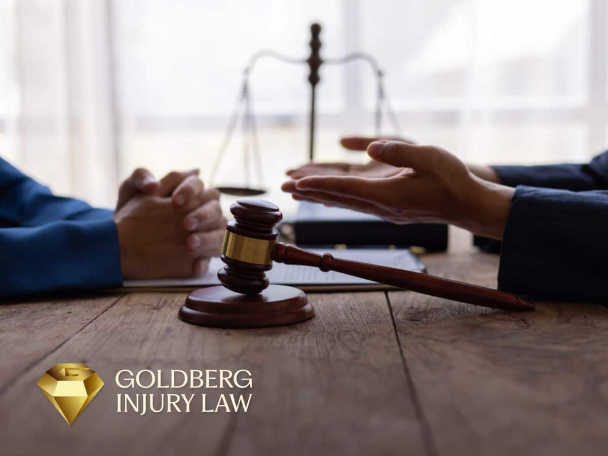 A lawyer discussing how Nevada’s comparative negligence rule affects a car accident claim with a client.